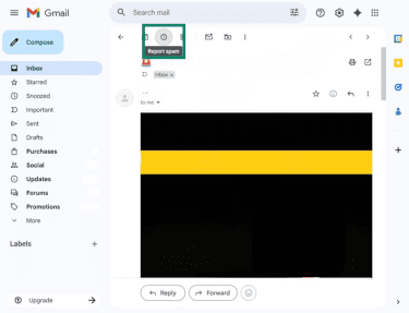 Gmail web app with an email open, highlighting the Report spam button